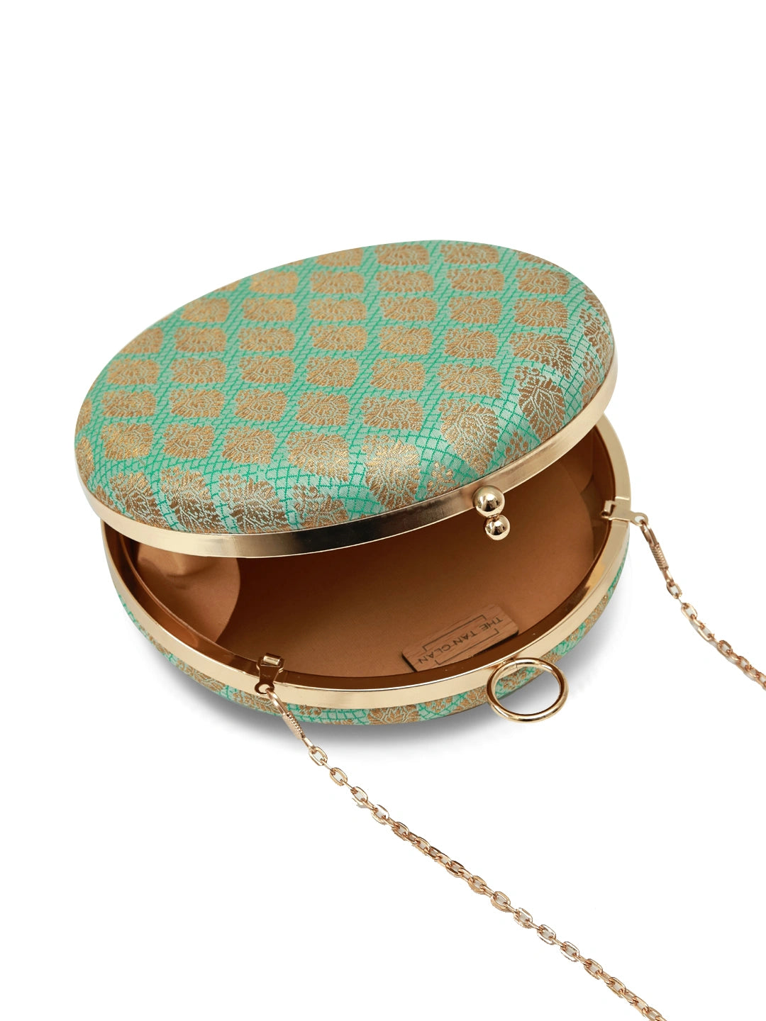 Green round clutch purse by The Tan Clan featuring a classic design with a smooth, vibrant green leather exterior.