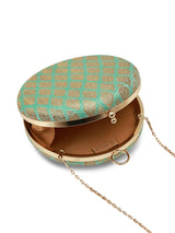 Green round clutch purse by The Tan Clan featuring a classic design with a smooth, vibrant green leather exterior.
