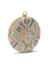 Mughal Round Clutch by The Tan Clan featuring intricate traditional design and a round shape with a smooth finish.