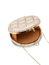 Inaara Peach round clutch bag by The Tan Clan, featuring a smooth textured surface and elegant circular design.