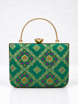Light green casket clutch bag by THE TAN CLAN featuring a sleek design and compact size for elegant occasions.