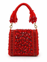 Red beaded mini flap bag by THE TAN CLAN with intricate beadwork and a compact design, perfect for stylish accessories.