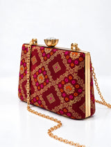 Mahi Red Casket Clutch by THE TAN CLAN, stylish rectangular evening bag with a textured finish and gold clasp detail.