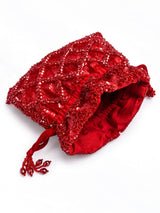 Red sequined tasselled potli bag by THE TAN CLAN with intricate embroidery and a drawstring closure.