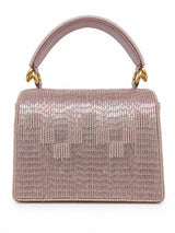 Maria Lilac handcrafted beaded tasselled bag by THE TAN CLAN featuring intricate beadwork and a decorative tassel in a vibrant lilac color.
