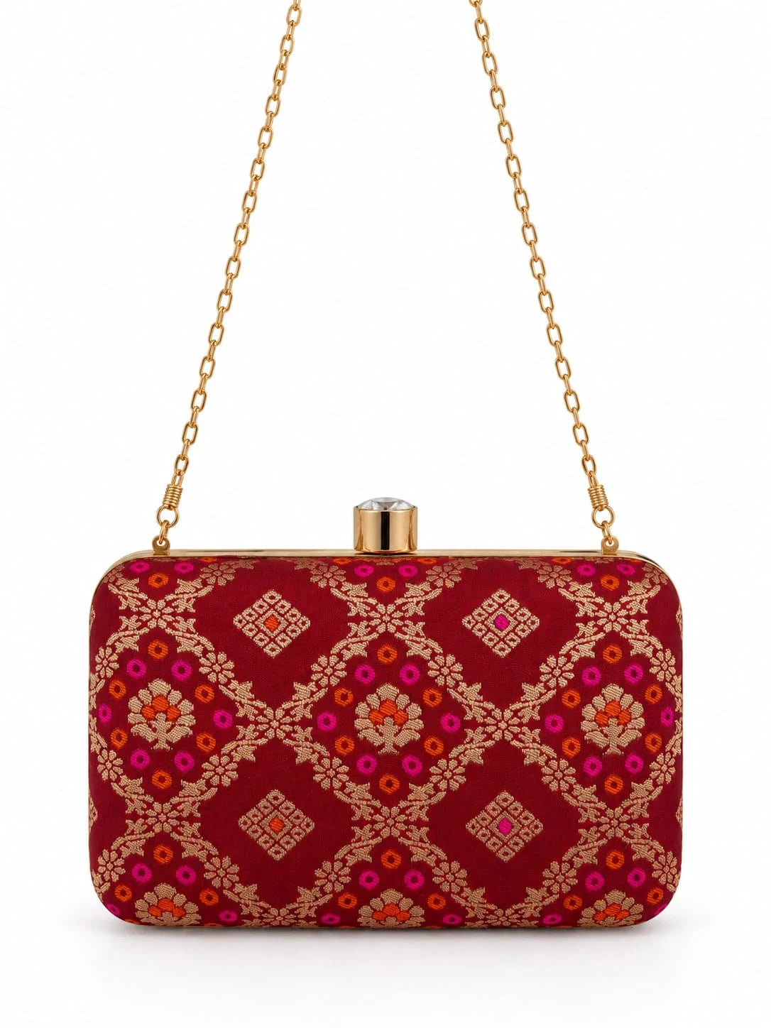 Red Mahi box clutch by THE TAN CLAN, featuring a sleek rectangular design with subtle texture and elegant gold accents.