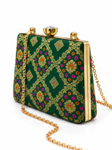 Dark green Mahi casket clutch by THE TAN CLAN featuring a sleek, structured design with a gold clasp and elegant finish.