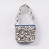 Grace mini bag from The Tan Clan with embroidered handle, featuring a compact design and stylish detailing.