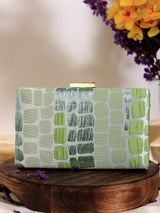 Coral Sleek Green Clutch by The Tan Clan featuring a smooth, vibrant coral-green exterior with a stylish compact design.