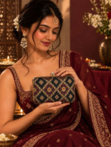 Mahi Black Box Clutch by THE TAN CLAN, sleek rectangular evening bag with gold accents and a textured surface.