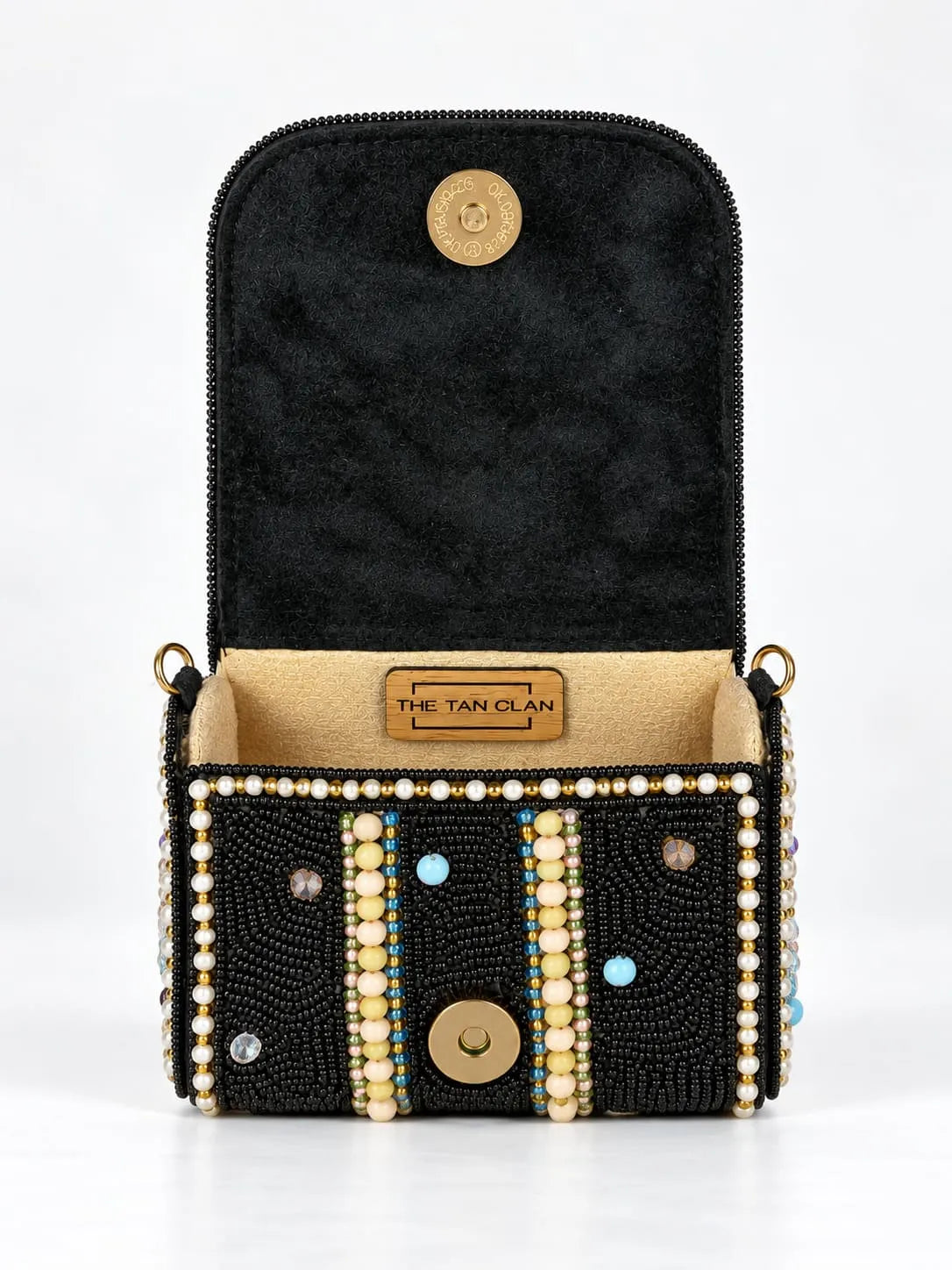 Black hand-embroidered mini flap purse by THE TAN CLAN with intricate embroidery and compact design.