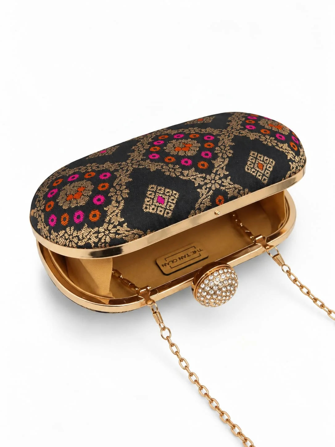 Black oval clutch bag by THE TAN CLAN featuring a sleek, minimalist design and smooth Mahi black leather finish.
