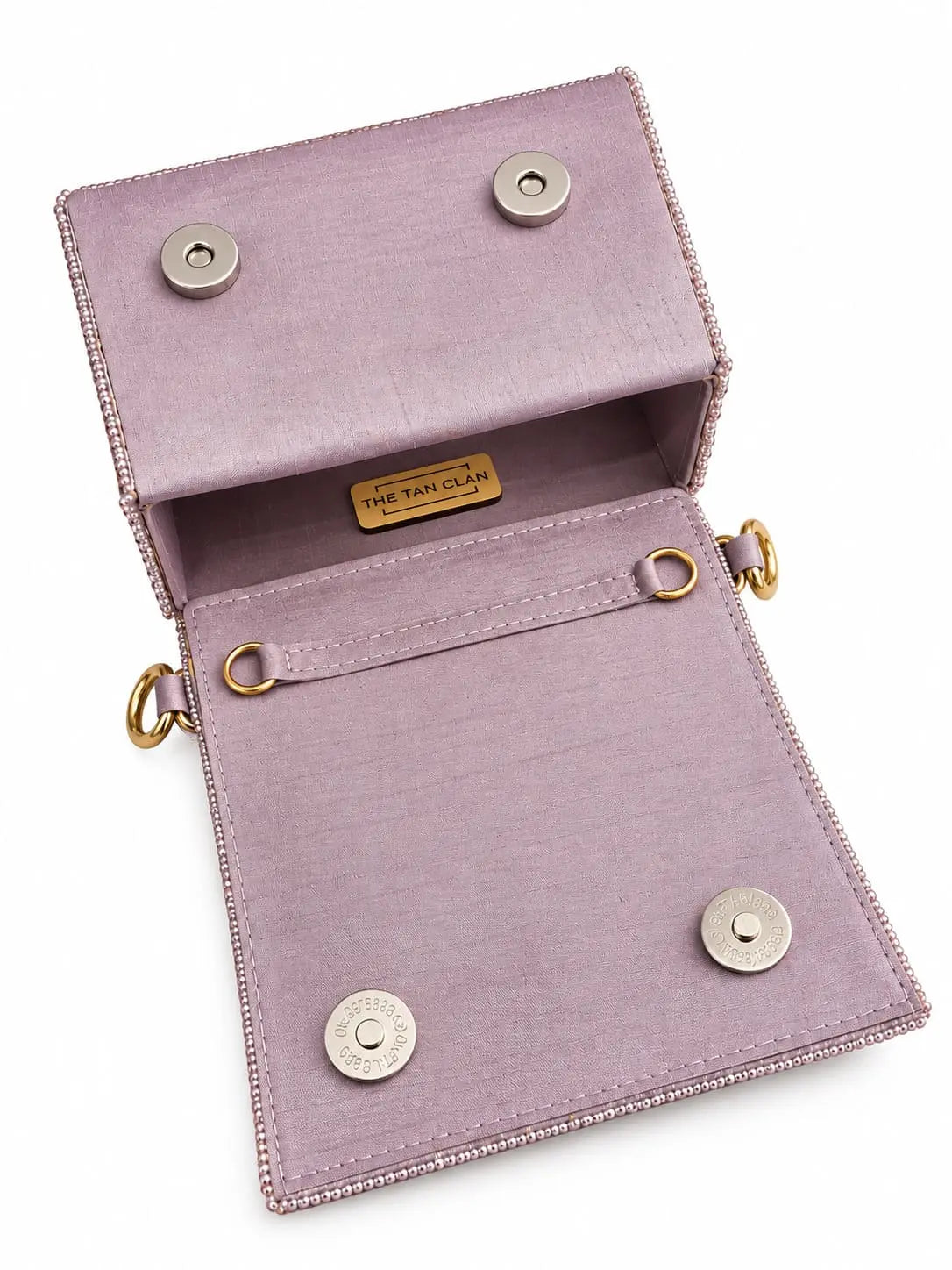 Maria Lilac handcrafted beaded tasselled bag by THE TAN CLAN featuring intricate beadwork and a tassel detail in a vibrant lilac color.