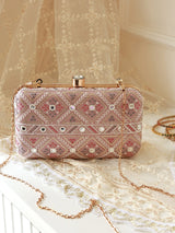 Pink box clutch bag by The Tan Clan featuring a sleek, modern design with a smooth finish and compact shape.