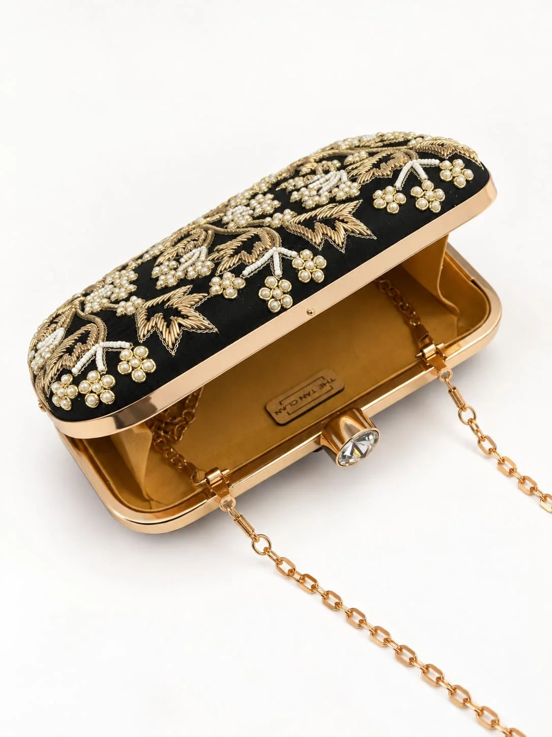 Black embroidered box clutch by THE TAN CLAN with intricate embroidery and a sleek, elegant design for special occasions.