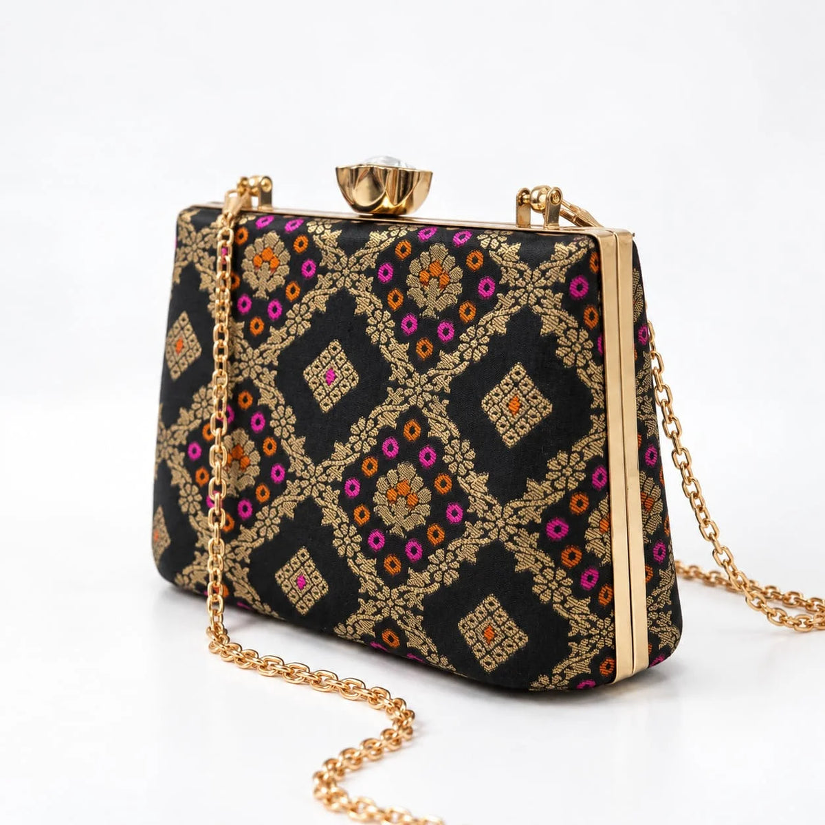 Black Mahi casket clutch bag by THE TAN CLAN with sleek design and compact size, perfect for evening or formal occasions.