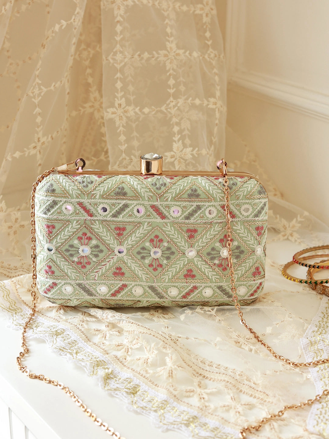 Ariba Green Box Clutch by The Tan Clan featuring a sleek, rectangular design with a smooth finish and a stylish clasp closure.