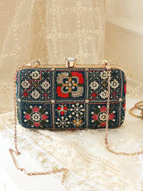 Elora Green Box Clutch by The Tan Clan, stylish rectangular purse with gold clasp and textured green exterior.
