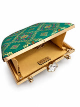 Light green Mahi casket clutch bag by THE TAN CLAN with a sleek, compact design and elegant closure, perfect for evening occasions.