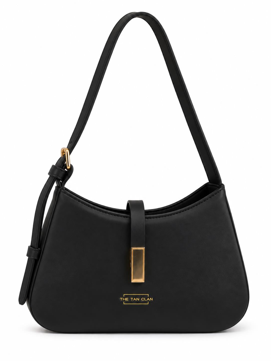 Black textured leather shoulder bag with gold clasp and adjustable strap from THE TAN CLAN.