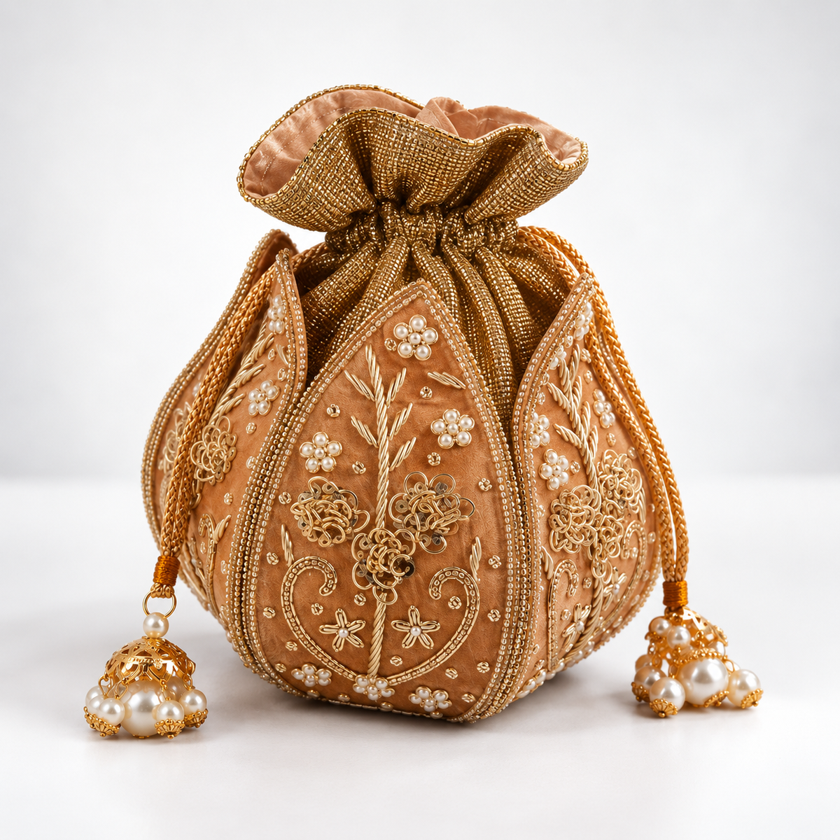 Mini lotus-shaped potli bag with Pushp Zardozi embroidery by The Tan Clan, featuring intricate floral embroidery and traditional design.