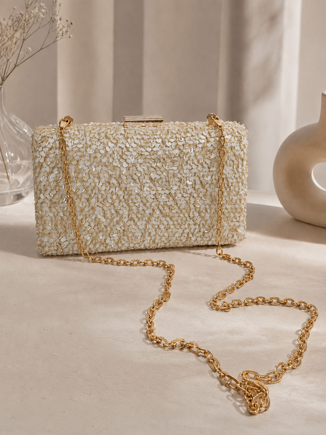 Gold sequined sleek clutch purse by The Tan Clan featuring shimmering sequins and a compact elegant design.