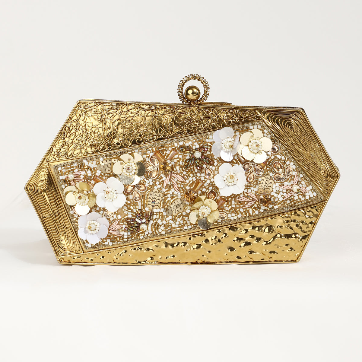 Silver brass clutch with gold embellishments and intricate designs, featuring the Fatima motif, by The Tan Clan.