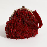 Red Rosa Batua bag with detachable handle by The Tan Clan, showing the stylish design and versatile strap on a plain background.