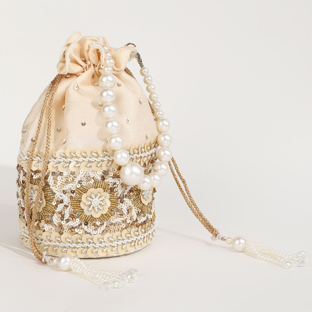Ama Potli Bag with pearl handle from The Tan Clan, showcasing a traditional embroidered design and elegant pearl accents.