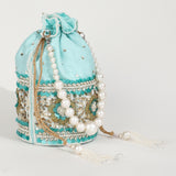 Ama Potli bag with pearl handle from The Tan Clan, featuring intricate embroidery and elegant design for special occasions.