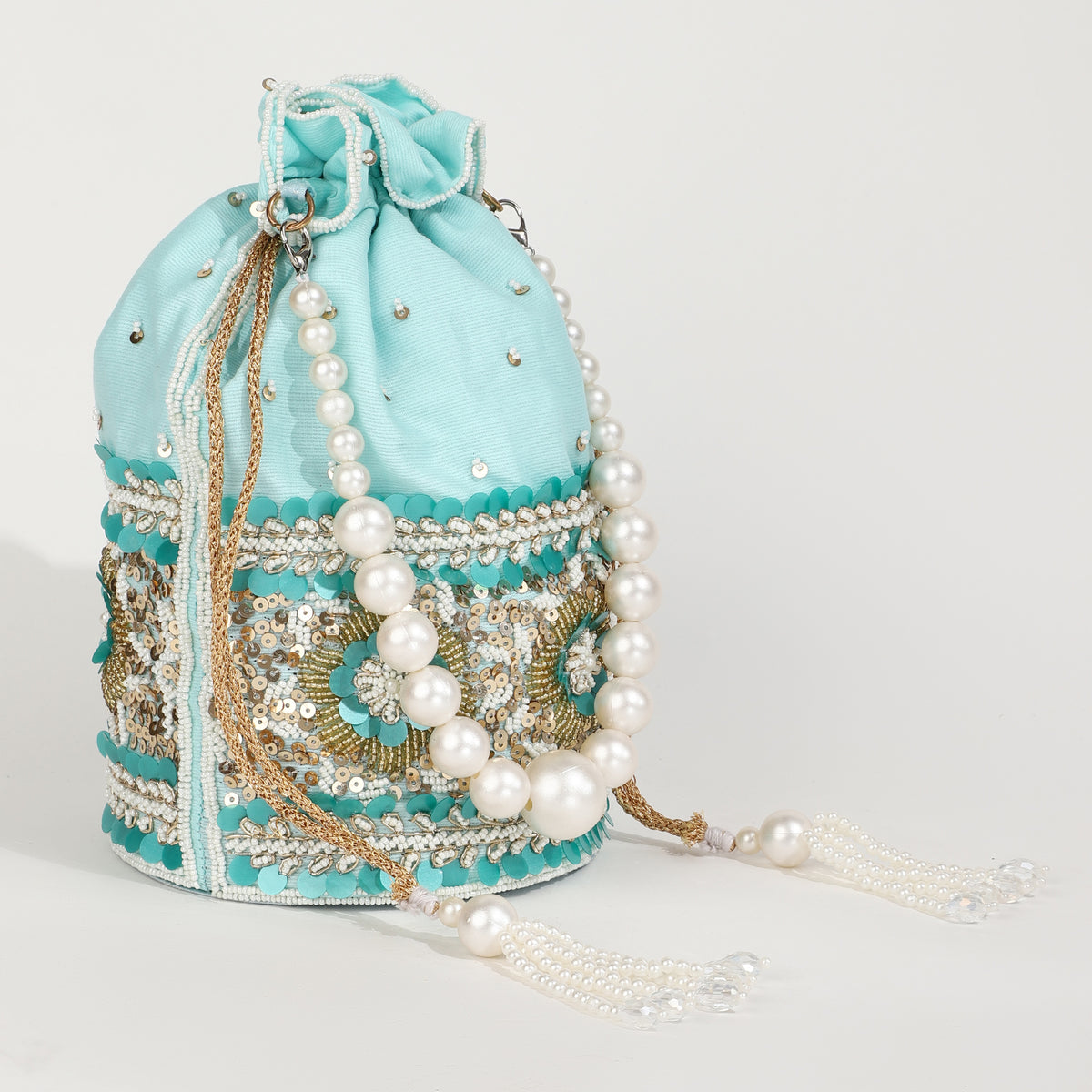 Ama Potli bag with pearl handle from The Tan Clan, featuring intricate embroidery and elegant design for special occasions.