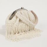 Pearl Batua bag with tassels from The Tan Clan, showcasing intricate design and decorative pearl embellishments.