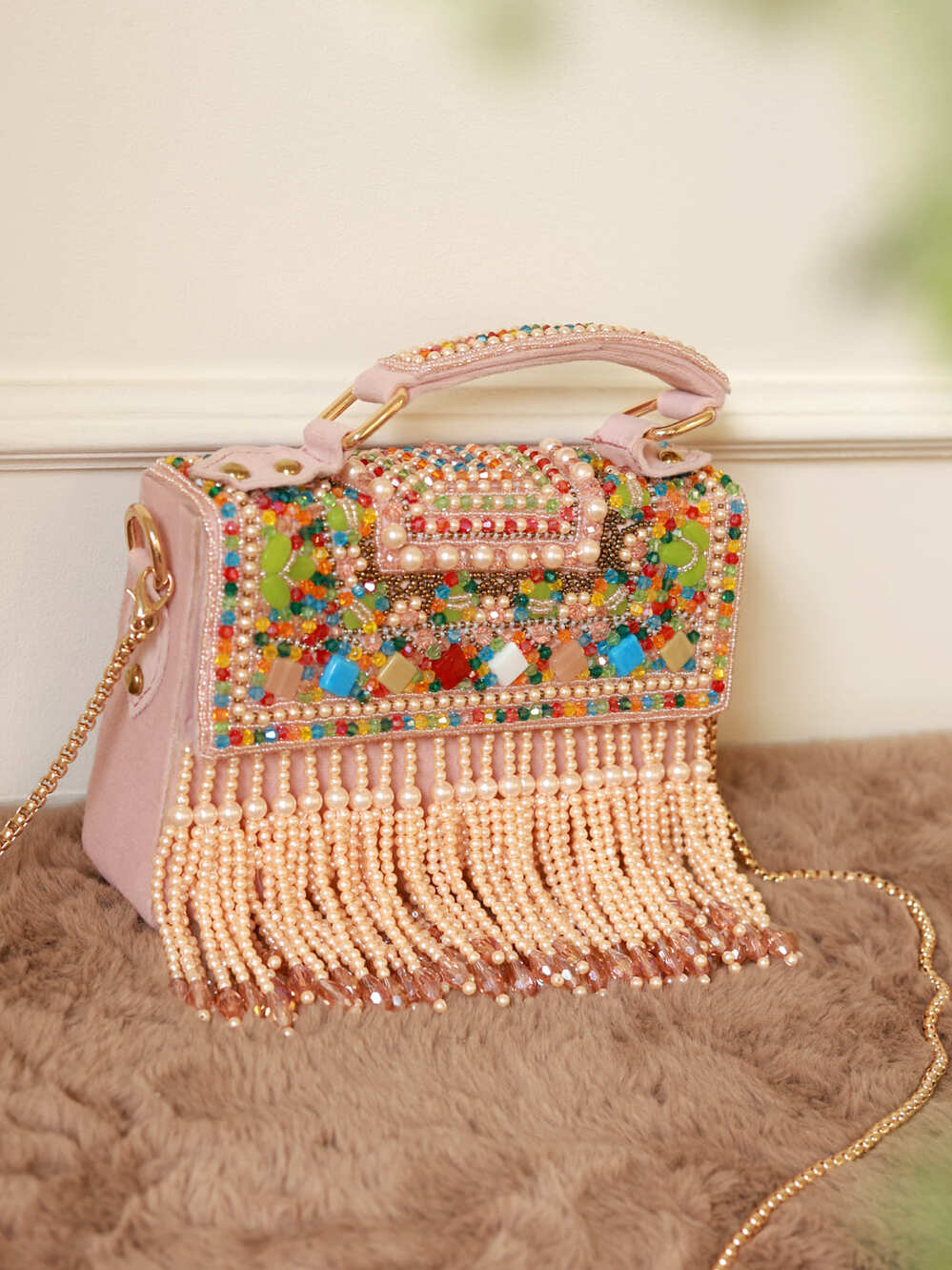 Kiara Multi_Flap Clutch Bag with Handle by The Tan Clan, featuring colorful overlapping flap design and compact style.