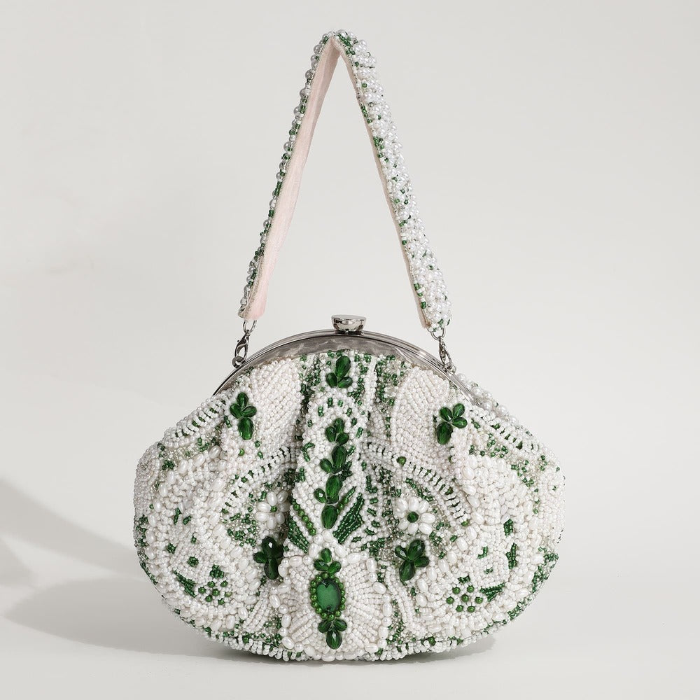 Tan Clan Paak Batua bag with detachable strap, stylish leather crossbody purse with woven design and adjustable strap.