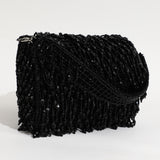 Black Rosa beaded flap-over clutch bag by The Tan Clan with intricate beadwork and elegant design.