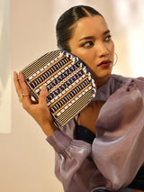 Blue flap-over bag with handle from The Tan Clan, featuring a stylish and spacious design for everyday use.