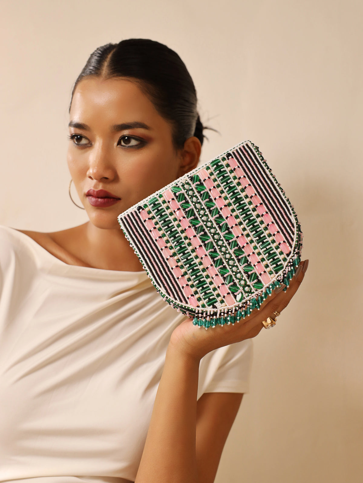 Asma green flap-over bag with handle from The Tan Clan, featuring a stylish design and spacious interior.
