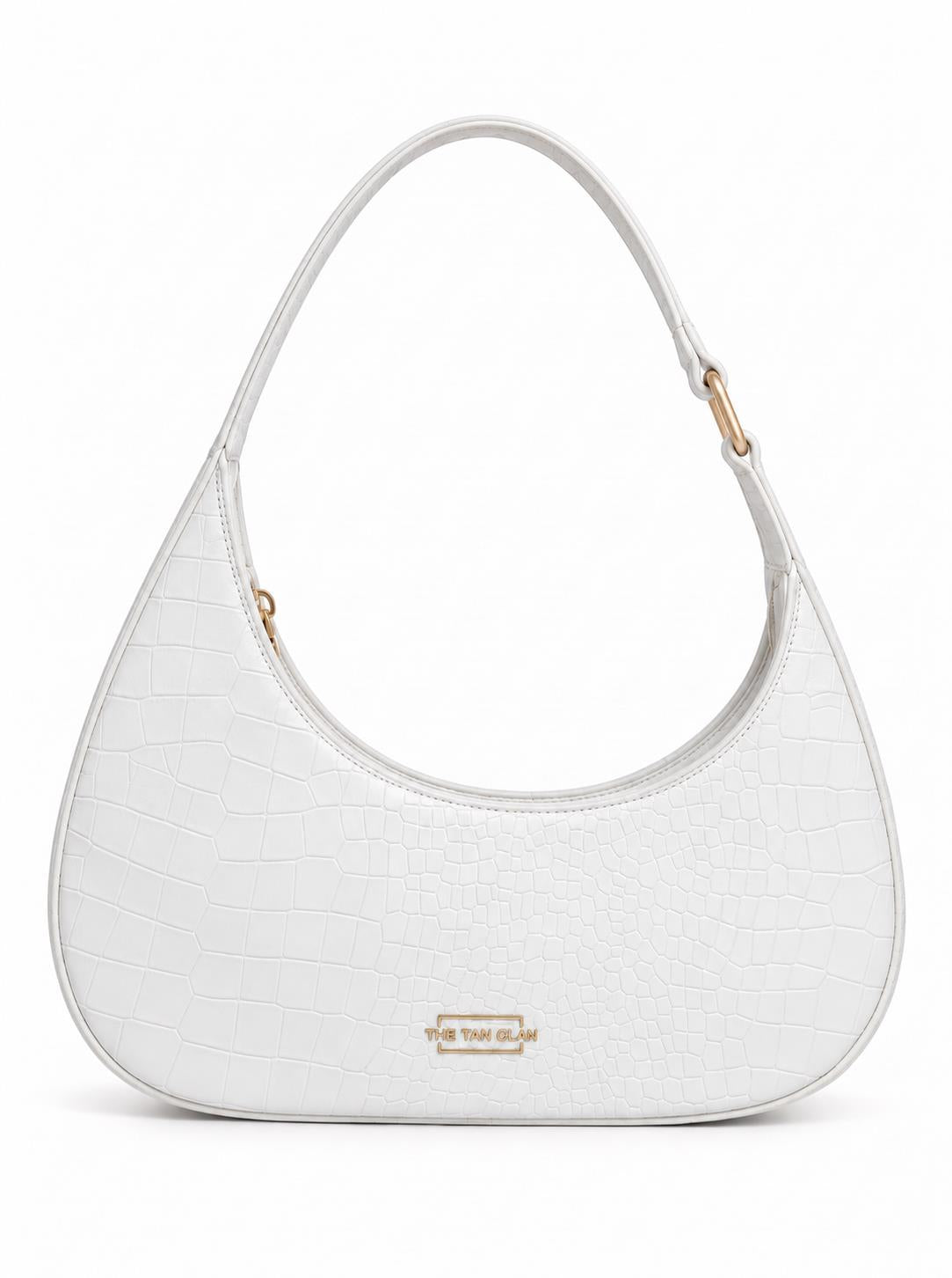 White crocodile-textured shoulder bag by THE TAN CLAN with sleek design and silver hardware, perfect for stylish everyday use.