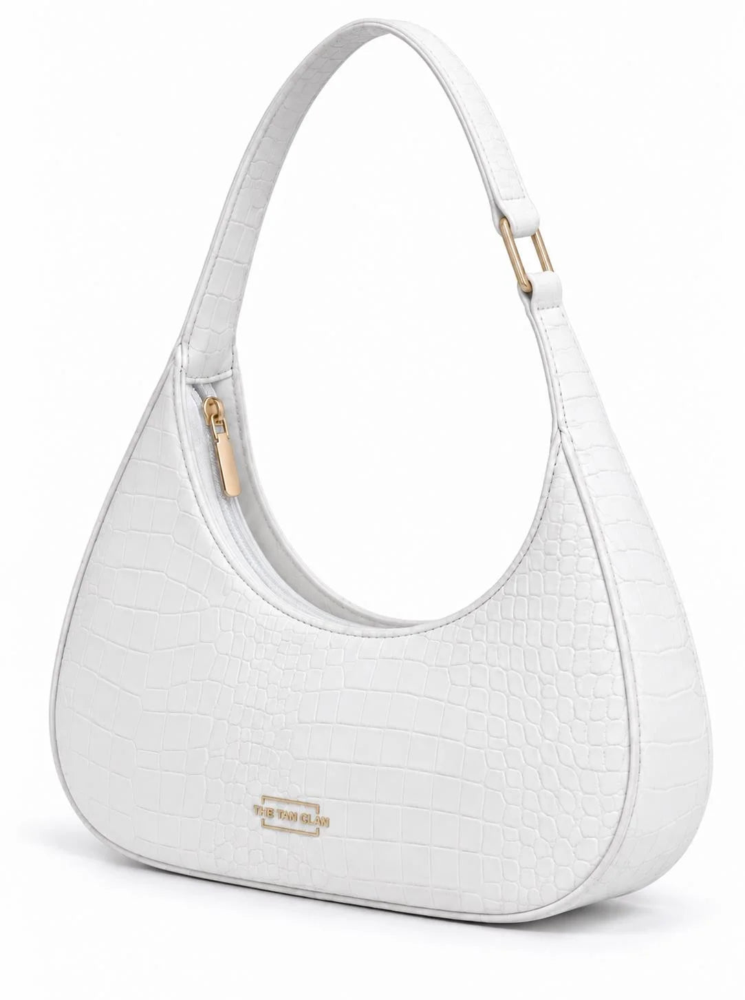 White croc-embossed Crescent shoulder bag by THE TAN CLAN, textured leather with a stylish, curved shape and shoulder strap.