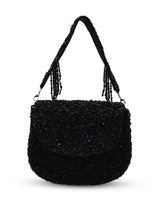 Black Amy flap-over bag from The Tan Clan, featuring a stylish flap closure and sleek design.