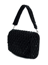 Black flap-over bag by The Tan Clan featuring a stylish design and spacious interior, perfect for everyday use.