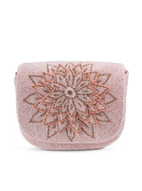 Pink Eva flap-over bag by The Tan Clan, showcasing a stylish leather-like design with a flap closure and sleek strap.