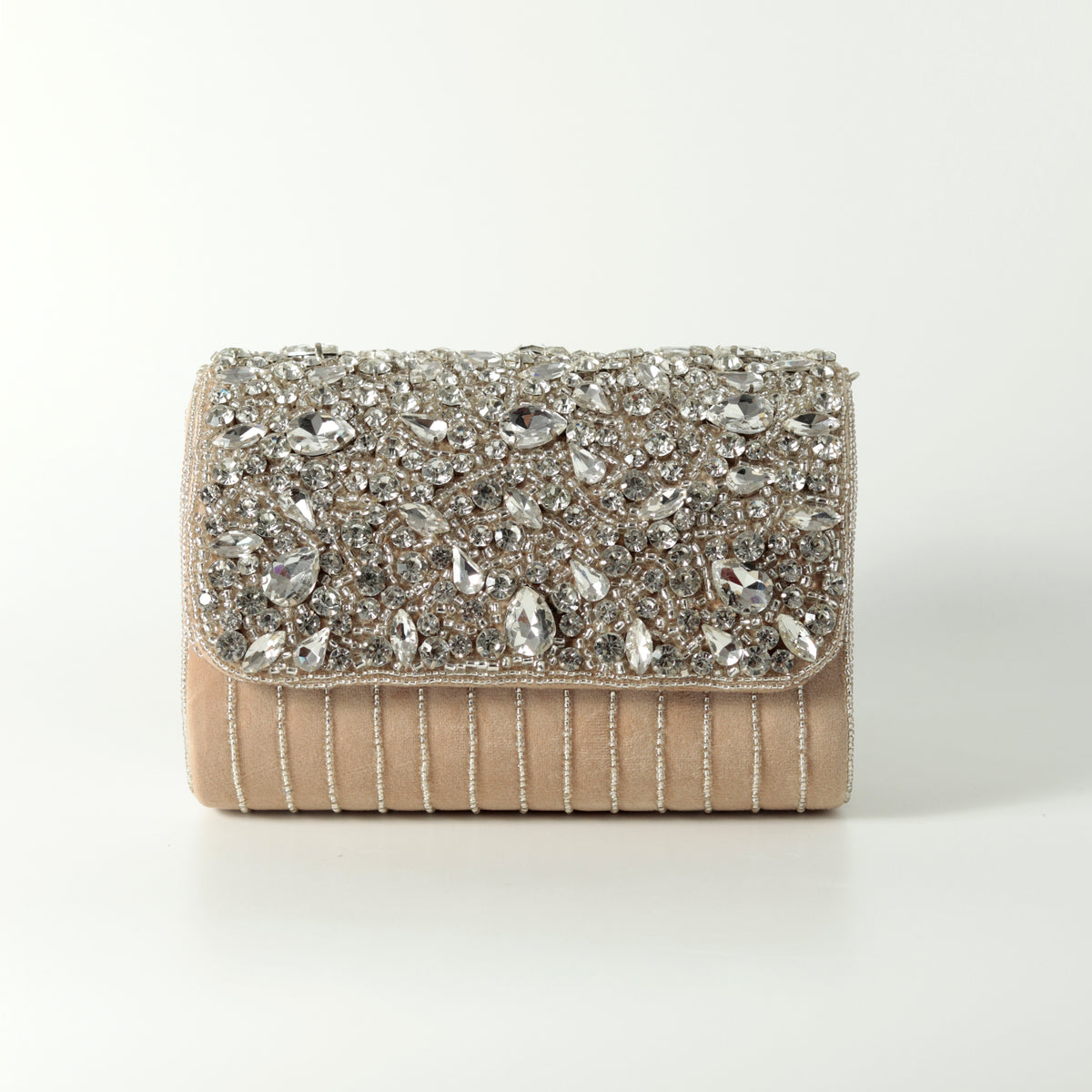 Beige Grace Embellished Flap Over Bag by The Tan Clan with decorative detailing and a stylish flap closure.