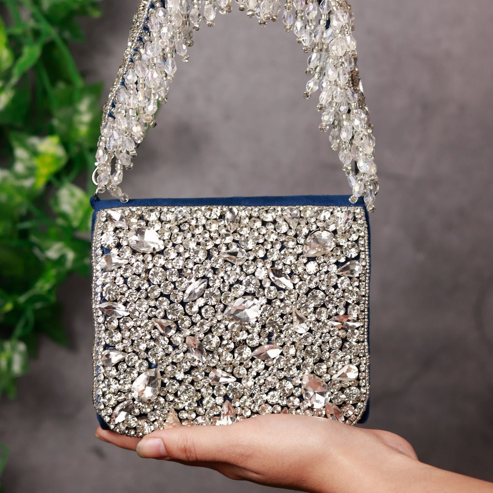 Blue Grace Mini Bag by The Tan Clan with embroidered handle, featuring a compact design and stylish details.