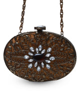 Mirza brass clutch by The Tan Clan featuring intricate embellishments and detailed craftsmanship, stylish evening accessory.