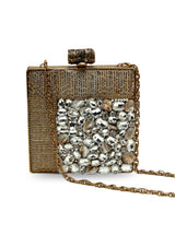 Brass clutch with sugar embellishments by The Tan Clan, featuring a sleek design and textured surface for elegant style.
