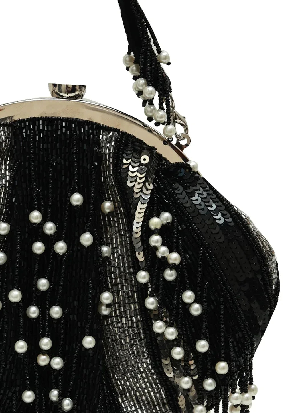 A black pearl Batua bag from The Tan Clan featuring traditional design and handcrafted details, displayed on a plain background.