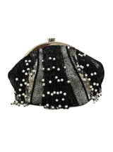 A black pearl Batua Bag from The Tan Clan with a sleek design and traditional woven detailing.