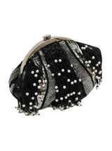 A black pearl Batua Bag from The Tan Clan, showcasing a traditional woven design with a sleek, elegant appearance.