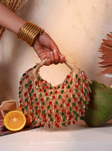Red and multicolor Bella Half Moon Batua Bag by The Tan Clan with vibrant design and adjustable strap.